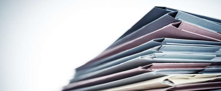 Essential estate planning documents stacked in a pile