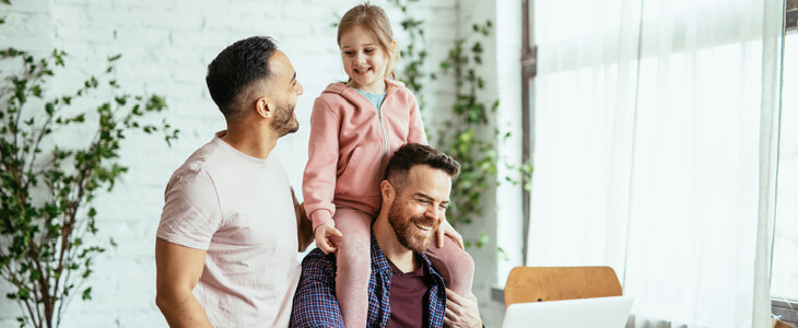 Gay couple with their daughter