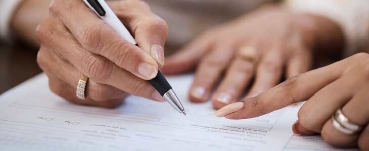 Woman signing her living will