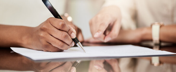 Woman signing a trust