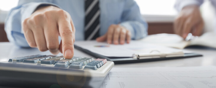 Businessman using a calculator