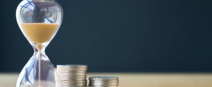 Time and stack of coins.