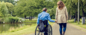 man with a disability with his family member