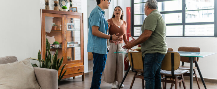 Parents and son arguing at home