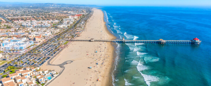 Aerial view of the beautiful Orange County California coastal city of Huntington Beach from an altitude of about 1000 feet over the Pacific Ocean during a helicopter photo flight.